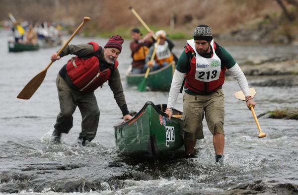 The team of Adam Vedoni and Dan Cassaday runs through low water near the start of the 46th annual Kenduskeag Stream Canoe race on Saturday, April 21, 2012. The team of Adam Vedoni and Dan Cassaday runs through low water near the start of the 46th annual Kenduskeag Stream Canoe race on Saturday, April 21, 2012.