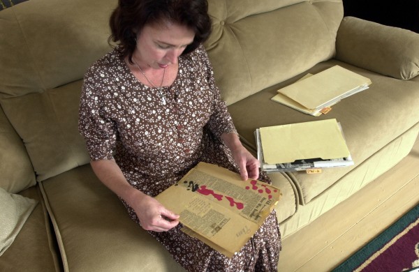 Sherry Sullivan looks through government documents about her father, Geoffrey Sullivan, who disappeared in 1963 over Cuba. Sherry Sullivan looks through government documents about her father, Geoffrey Sullivan, who disappeared in 1963 over Cuba.