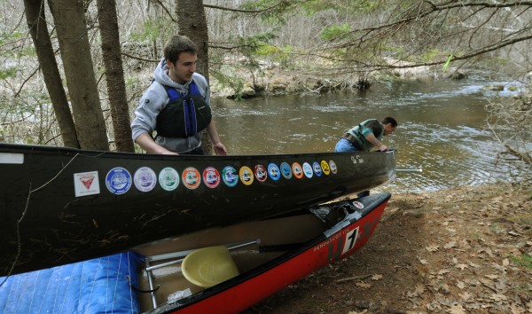 A competitor drags his canoe over the top of another racer's boat at a portage during the Passagassawakeag Stream Canoe Race on Saturday, April 7, 2012. Low water had the racers doubling back and paddling upstream for the last half of the race. A competitor drags his canoe over the top of another racer's boat at a portage during the Passagassawakeag Stream Canoe Race on Saturday, April 7, 2012. Low water had the racers doubling back and paddling upstream for the last half of the race.
