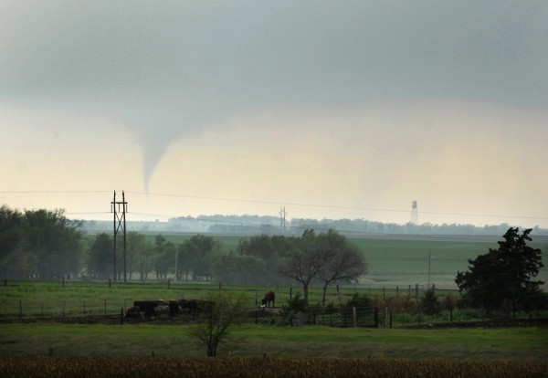 A funnel cloud dips down from the clouds on Saturday, April 14, 2012, just southwest of Otis, Kansas as severe thunderstorms roll across Kansas. The funnel touched down briefly before the storm weakened. Supercell thunderstorms spawned numerous tornadoes in Kansas on Saturday. A funnel cloud dips down from the clouds on Saturday, April 14, 2012, just southwest of Otis, Kansas as severe thunderstorms roll across Kansas. The funnel touched down briefly before the storm weakened. Supercell thunderstorms spawned numerous tornadoes in Kansas on Saturday.