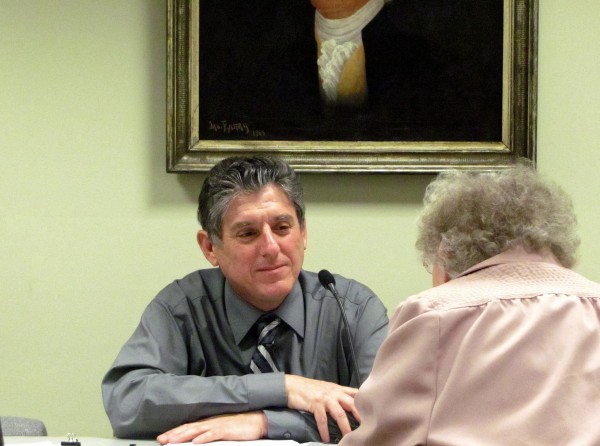 Roger Raymond talks to a long-time former in Bucksport's town office on Thursday, April 19, 2012, during Raymond's final meeting as town manager. Raymond retired last week after 27 years with Bucksport. Roger Raymond talks to a long-time former in Bucksport's town office on Thursday, April 19, 2012, during Raymond's final meeting as town manager. Raymond retired last week after 27 years with Bucksport.