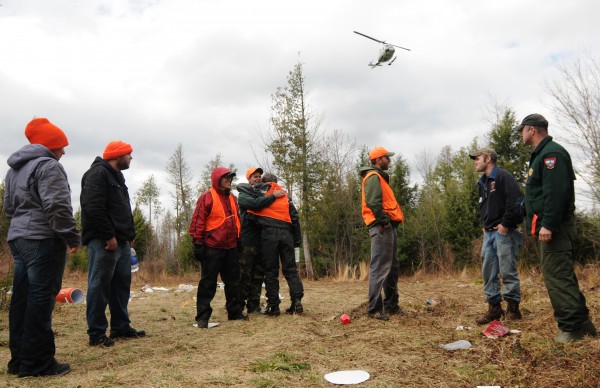 Family members and friends of Dean Levasseur embrace on Tuesday, April 24, 2012 before they embark on a search for the missing man as a Maine Forest Service helicopter passes over head near the spot where Levasseur was last seen in Howland at Chickenfest on Saturday. Family members and friends of Dean Levasseur embrace on Tuesday, April 24, 2012 before they embark on a search for the missing man as a Maine Forest Service helicopter passes over head near the spot where Levasseur was last seen in Howland at Chickenfest on Saturday.