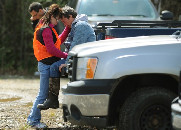 Dan Levasseur is comforted by a friend named Julie on Wednesday, April 25, 2012 after learning that the body of his son Dean Levasseur had been found by game wardens with a K-9 unit in a dense wooded area of Howland not too far from the stage area at the Chickenfest party held on Saturday, April 21, 2012. Dan Levasseur is comforted by a friend named Julie on Wednesday, April 25, 2012 after learning that the body of his son Dean Levasseur had been found by game wardens with a K-9 unit in a dense wooded area of Howland not too far from the stage area at the Chickenfest party held on Saturday, April 21, 2012.