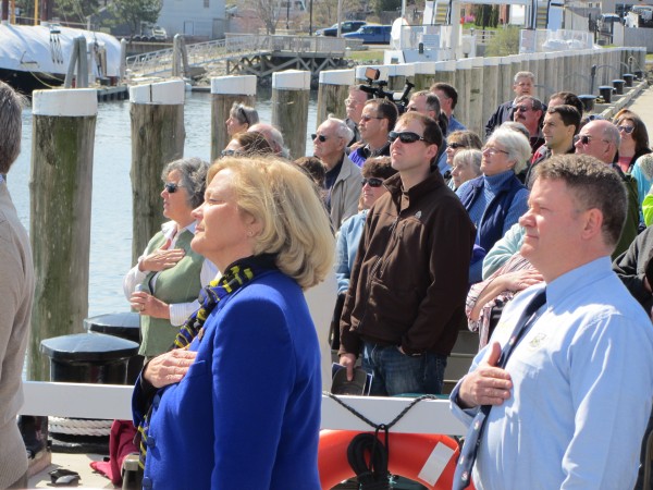 U.S. Rep. Chellie Pingree (left foreground), D-Maine, and Deputy Maine Department of Transportation Commissioner Bruce Van Note stand at attention during the playing of the national anthem during the christening ceremonies for the new state ferry. U.S. Rep. Chellie Pingree (left foreground), D-Maine, and Deputy Maine Department of Transportation Commissioner Bruce Van Note stand at attention during the playing of the national anthem during the christening ceremonies for the new state ferry.
