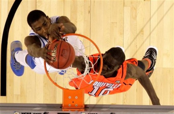 Kentucky forward Michael Kidd-Gilchrist (14) slam dunks over Louisville center Gorgui Dieng (10) during the second half of an NCAA Final Four semifinal college basketball tournament game Saturday, March 31, 2012, in New Orleans. Kentucky won 69-61. Kentucky forward Michael Kidd-Gilchrist (14) slam dunks over Louisville center Gorgui Dieng (10) during the second half of an NCAA Final Four semifinal college basketball tournament game Saturday, March 31, 2012, in New Orleans. Kentucky won 69-61.