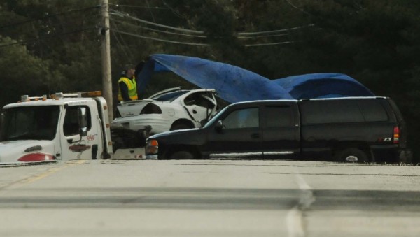 A wrecker driver covers a car that was involved in a fatal accident on South Main Street in Old Town on Tuesday, April 10, 2012. A wrecker driver covers a car that was involved in a fatal accident on South Main Street in Old Town on Tuesday, April 10, 2012.