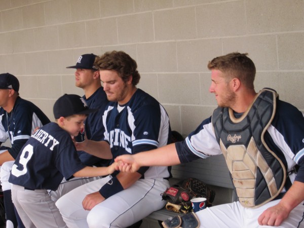 University of Maine catcher Tyler Patzalek (right) plays around in the dugout with Black Bears bat boy Patrick Flaherty as Ian Leisenheimer looks on moments before the start of Wednesday's America East baseball playoff game at Stony Brook, N.Y. Stony Brook won 14-6. University of Maine catcher Tyler Patzalek (right) plays around in the dugout with Black Bears bat boy Patrick Flaherty as Ian Leisenheimer looks on moments before the start of Wednesday's America East baseball playoff game at Stony Brook, N.Y. Stony Brook won 14-6.