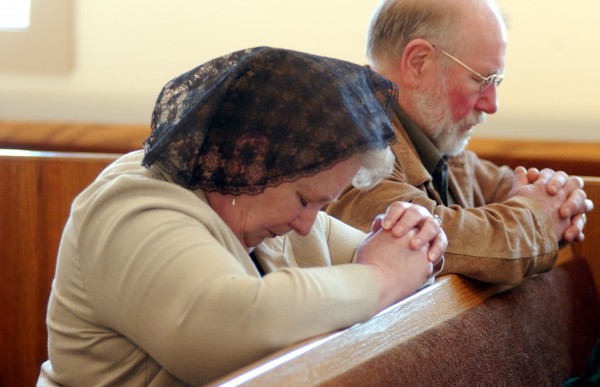 Bar Harbor residents Valery and Mike McCadden pray during a Sunday worship service at the St. Thomas Traditional Anglican Church in Ellsworth. Bar Harbor residents Valery and Mike McCadden pray during a Sunday worship service at the St. Thomas Traditional Anglican Church in Ellsworth.