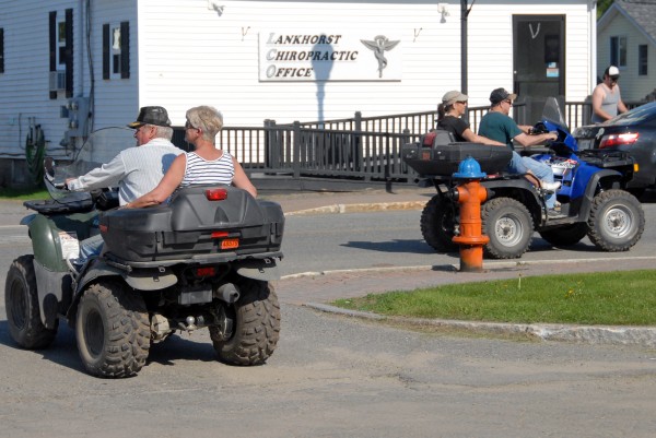 ATV riders turn onto Penobscot Avenue after having ice cream cones in a nearby park in Millinocket on Sunday, May 20, 2012. The town's new multiuse trail and spur into downtown are off to a promising start, organizers say. ATV riders turn onto Penobscot Avenue after having ice cream cones in a nearby park in Millinocket on Sunday, May 20, 2012. The town's new multiuse trail and spur into downtown are off to a promising start, organizers say.