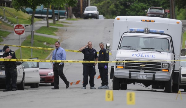Bangor Police Detective Larry Ellis (center left) and Sgt. Paul Edwards (center right) confer while they help fellow officers investigate the area of a fatal stabbing on First Street in Bangor that took place there early Tuesday, May 22, 2012. Bangor Police Detective Larry Ellis (center left) and Sgt. Paul Edwards (center right) confer while they help fellow officers investigate the area of a fatal stabbing on First Street in Bangor that took place there early Tuesday, May 22, 2012.