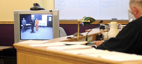 Kristina Lowe, 19, appearing in Lewiston District Court by video from the Oxford County Jail in Paris, stood by her attorney, James Howaniec of Lewiston, on Wednesday, May 2, as Justice Donald Alexander explained that her case would go to an Oxford County grand jury. Kristina Lowe, 19, appearing in Lewiston District Court by video from the Oxford County Jail in Paris, stood by her attorney, James Howaniec of Lewiston, on Wednesday, May 2, as Justice Donald Alexander explained that her case would go to an Oxford County grand jury.