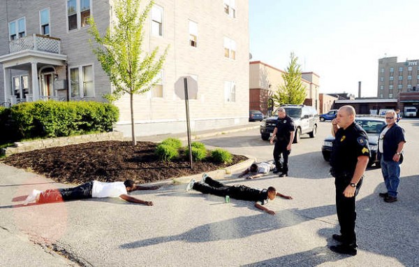 Police officers have three men on the ground near the corner of Bates and Ash Streets in Lewiston on Friday evening. Police officers have three men on the ground near the corner of Bates and Ash Streets in Lewiston on Friday evening.