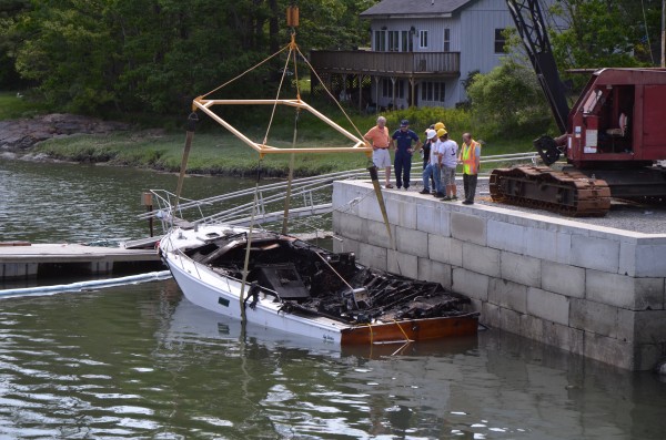 Officials investigate a boat explosion that injured two people at New Meadows Marina in Brunswick on Monday, May 28, 2012. Brunswick fire officials said a husband and wife were hospitalized after their 36-foot pleasure boat exploded while they were fueling it up at the marina. Officials investigate a boat explosion that injured two people at New Meadows Marina in Brunswick on Monday, May 28, 2012. Brunswick fire officials said a husband and wife were hospitalized after their 36-foot pleasure boat exploded while they were fueling it up at the marina.