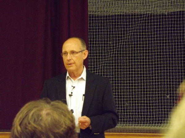 Cianbro Chairman and CEO Peter Vigue talks to the crowd in Foxcroft Academy's gymnasium during a public meeting regarding the east-west highway proposal on Thursday. Cianbro Chairman and CEO Peter Vigue talks to the crowd in Foxcroft Academy's gymnasium during a public meeting regarding the east-west highway proposal on Thursday.