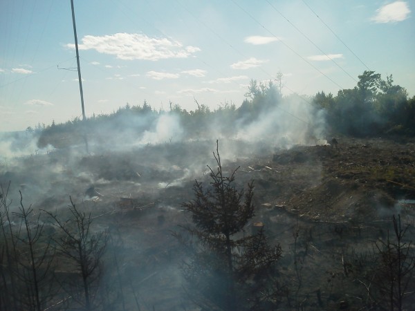 Firefighters from the Maine Forest Service, Danforth and Moosehorn National Wildlife Refuge were battling a 4- to 5-acre fire on top of Flagstaff Mountain in northern Washington County on Sunday. A wind energy test tower on the site was damaged by the fire. Firefighters from the Maine Forest Service, Danforth and Moosehorn National Wildlife Refuge were battling a 4- to 5-acre fire on top of Flagstaff Mountain in northern Washington County on Sunday. A wind energy test tower on the site was damaged by the fire.