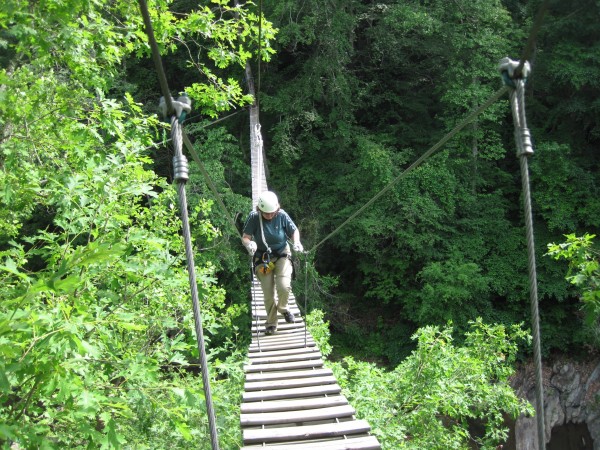 Freelancer Julia Bayly slowly works her way across the 600-foot Sky Trek Bridge at Historic Banning Mills in Georgia. Freelancer Julia Bayly slowly works her way across the 600-foot Sky Trek Bridge at Historic Banning Mills in Georgia.