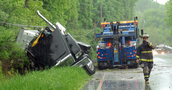 Traffic backs up after a tractor-trailer rolled over in a ditch and brought down a power line going northbound on Route 7 in Dixmont Tuesday morning. Traffic backs up after a tractor-trailer rolled over in a ditch and brought down a power line going northbound on Route 7 in Dixmont Tuesday morning.