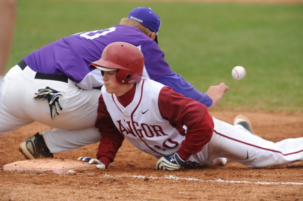 Bangor's Carl Farnham dives back to first base during this pick-off play as Hampden first baseman Fred Knight drops the throw allowing Farnham to advance to second base during first inning action at Bangor on Thursday, May 3, 2012. Bangor's Carl Farnham dives back to first base during this pick-off play as Hampden first baseman Fred Knight drops the throw allowing Farnham to advance to second base during first inning action at Bangor on Thursday, May 3, 2012.