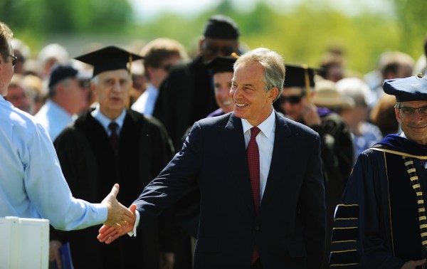 Former British Prime Minister Tony Blair shakes hands with people as he walks with the 2012 graduating class of Colby College during commencent ceremonies in Waterville on Sunday, May 20, 2012. Former British Prime Minister Tony Blair shakes hands with people as he walks with the 2012 graduating class of Colby College during commencent ceremonies in Waterville on Sunday, May 20, 2012.