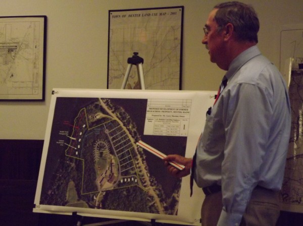 Al Hodsdon, of A.E. Hodsdon Consulting Engineers in Waterville, shows the initial concept of Gerry Marshall's vision for the former high school property near Lake Wassokeag during a Dexter Planning Board meeting on Thursday, May 24, 2012. The proposed plans include cabins near the lake, a campground in the center of the property, apartments in the old elementary school building and apartments on the Grove Street side. Al Hodsdon, of A.E. Hodsdon Consulting Engineers in Waterville, shows the initial concept of Gerry Marshall's vision for the former high school property near Lake Wassokeag during a Dexter Planning Board meeting on Thursday, May 24, 2012. The proposed plans include cabins near the lake, a campground in the center of the property, apartments in the old elementary school building and apartments on the Grove Street side.