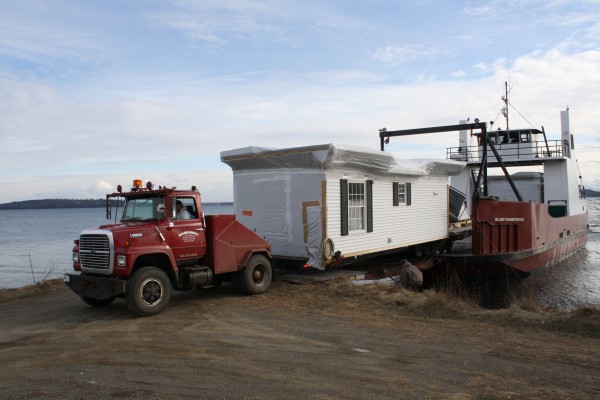 One of the new affordable housing units, a modular home, is delivered by barge to Islesboro. One of the new affordable housing units, a modular home, is delivered by barge to Islesboro.