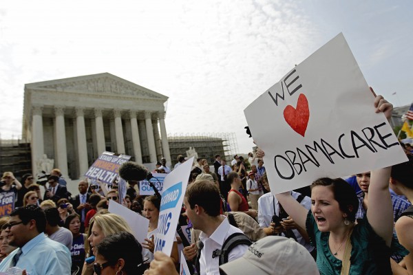 Supporters of President Barack Obama's health care law celebrate outside the Supreme Court in Washington, Thursday, June 28, 2012, after the court's ruling was announced. Supporters of President Barack Obama's health care law celebrate outside the Supreme Court in Washington, Thursday, June 28, 2012, after the court's ruling was announced.