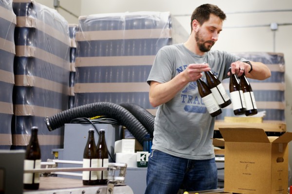 Brewer Kevin Glessing boxes up freshly labeled bottles of Peeper Ale at Maine Beer Co. Wednesday, June 6, 2012, in Portland. The Maine Beer Company is off Riverside Street, within a stone's throw of several other craft breweries. Brewer Kevin Glessing boxes up freshly labeled bottles of Peeper Ale at Maine Beer Co. Wednesday, June 6, 2012, in Portland. The Maine Beer Company is off Riverside Street, within a stone's throw of several other craft breweries.