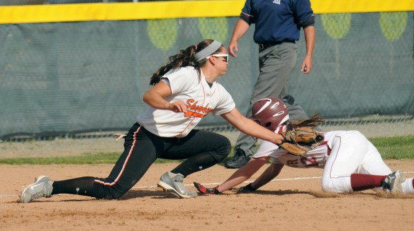 Skowhegan High School's Shelby Obert (left) tags Bangor High School's Annie Guare at third base during the quarterfinal game in Bangor Thursday. Skowhegan High School's Shelby Obert (left) tags Bangor High School's Annie Guare at third base during the quarterfinal game in Bangor Thursday.