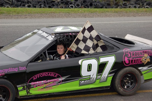 Becky Elston of Carmel holds the checkered flag after winning a Sport Four race at Speedway 95 in Hermon last year. Elston currently is second in the Sport Four points race this season. Becky Elston of Carmel holds the checkered flag after winning a Sport Four race at Speedway 95 in Hermon last year. Elston currently is second in the Sport Four points race this season.