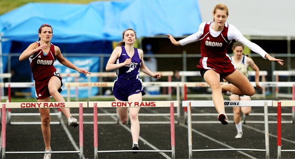 Orono's Abby Weigang (right) sails over the hurdle just before teammate Kayla Marquis (left) and competitor Ciara Petrello from John Bapst during the fourth section of the 300-meter hurdles at the Class C State Championships in Augusta Saturday. Orono's Abby Weigang (right) sails over the hurdle just before teammate Kayla Marquis (left) and competitor Ciara Petrello from John Bapst during the fourth section of the 300-meter hurdles at the Class C State Championships in Augusta Saturday.