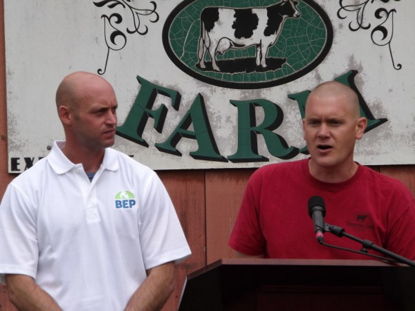 Adam Wintle (left), managing partner for Biogas Energy Partners, and Travis Fogler, Stonyvale Farm dairy operations manager, speak to a crowd about the unveiling of their anaerobic digestion system at Stonyvale Farm in Exeter on Thursday, June 7, 2012. The farm is capable of turning cow manure and food waste into biofuel that is burned to produce electricity. That electricity is sold to Bangor Hydro. Adam Wintle (left), managing partner for Biogas Energy Partners, and Travis Fogler, Stonyvale Farm dairy operations manager, speak to a crowd about the unveiling of their anaerobic digestion system at Stonyvale Farm in Exeter on Thursday, June 7, 2012. The farm is capable of turning cow manure and food waste into biofuel that is burned to produce electricity. That electricity is sold to Bangor Hydro.