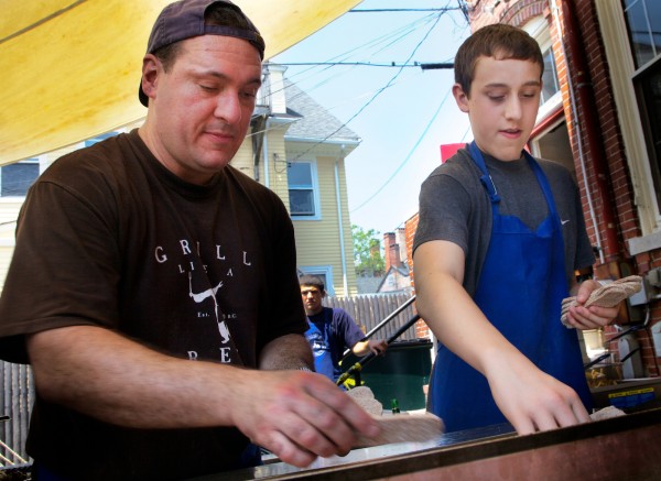 Tim Morrell, along with his 16-year-old son Matt, put more gyro on the grill at the annual Greek Food Festival put on by Holy Trinity Greek Orthodox Church on Pleasant Street in Portland on Friday, June 29, 2012. Tim Morrell, along with his 16-year-old son Matt, put more gyro on the grill at the annual Greek Food Festival put on by Holy Trinity Greek Orthodox Church on Pleasant Street in Portland on Friday, June 29, 2012.