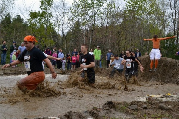 Contestants plow through a puddle in the University of Southern Maine's 2012 Into the Mud Challenge in Gorham, Maine, May 5, 2012. (Photo courtesy USM)
Contestants plow through a puddle in the University of Southern Maine's 2012 Into the Mud Challenge in Gorham, Maine, May 5, 2012. (Photo courtesy USM)