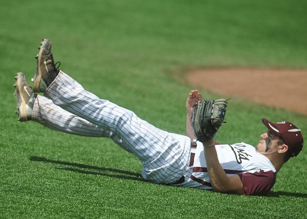 Orono High School's Bryce Mehnert recoils on the infield after successfully diving to catch a drive by a Dexter High School batter in the third inning of the Eastern Maine Class C baseball semifinal at Mahaney Diamond in Orono Saturday, June 9, 2012. Orono High School's Bryce Mehnert recoils on the infield after successfully diving to catch a drive by a Dexter High School batter in the third inning of the Eastern Maine Class C baseball semifinal at Mahaney Diamond in Orono Saturday, June 9, 2012.