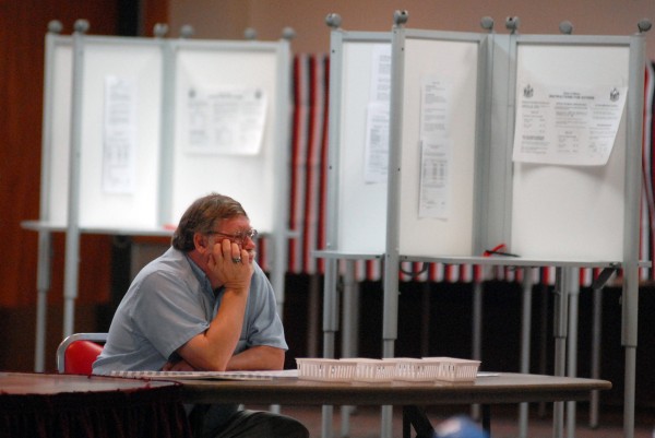 Election worker Dave Clark waits for voters to come through his line Tuesday morning at the Bangor Civic Center, as turnout was slow. "It's as expected probably," said Clark. "It's early. Usually around 5 p.m. it picks up." Election worker Dave Clark waits for voters to come through his line Tuesday morning at the Bangor Civic Center, as turnout was slow. "It's as expected probably," said Clark. "It's early. Usually around 5 p.m. it picks up."