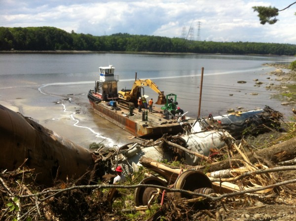 Crews from Maine Coast Marine prepare to use a tugboat and barge to remove several railroad tanker cars that derailed in late May and went into the Penobscot River in Bucksport. Crews from Maine Coast Marine prepare to use a tugboat and barge to remove several railroad tanker cars that derailed in late May and went into the Penobscot River in Bucksport.