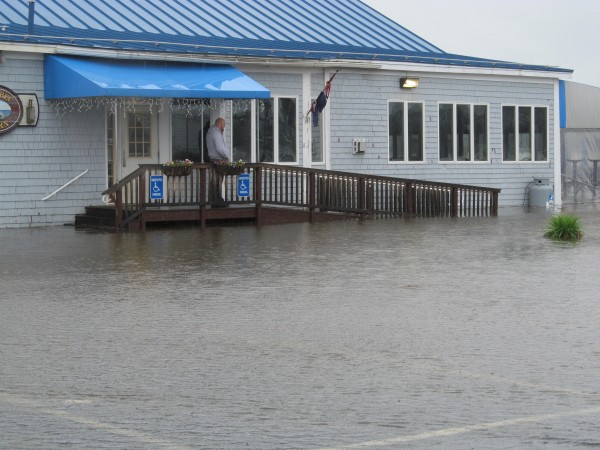 Instead of a parking lot full of cars, the lot at Kennebec Tavern was covered with water from the Kennebec River on Monday. Instead of a parking lot full of cars, the lot at Kennebec Tavern was covered with water from the Kennebec River on Monday.
