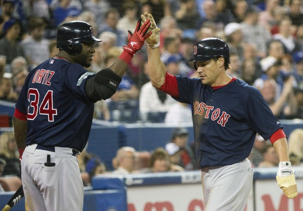 Boston Red Sox's Scott Podsednik (right) celebrates with teammate David Ortiz after scoring a run against the Toronto Blue Jays during eighth-inning action in Toronto on Friday, June 1, 2012. Boston Red Sox's Scott Podsednik (right) celebrates with teammate David Ortiz after scoring a run against the Toronto Blue Jays during eighth-inning action in Toronto on Friday, June 1, 2012.