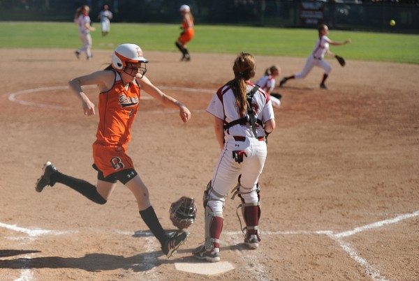 Brewer High School's Morgan Small crosses home plate to score as the Bangor High School catcher keeps an eye on a teammate's throw to first base during the fourth inning of their Eastern Maine Class A softball semifinal at Bangor High School Saturday afternoon, June 9, 2012. Brewer defeated Bangor 7-1. Brewer High School's Morgan Small crosses home plate to score as the Bangor High School catcher keeps an eye on a teammate's throw to first base during the fourth inning of their Eastern Maine Class A softball semifinal at Bangor High School Saturday afternoon, June 9, 2012. Brewer defeated Bangor 7-1.