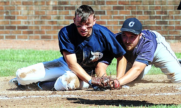 T.J. Frost is safe at home after Calais' pitcher Adam Geel stepped up to protect the plate in the Class C State Baseball Championship on Saturday at Saint Joseph's College in Standish. The Cougars took the title 6-1. T.J. Frost is safe at home after Calais' pitcher Adam Geel stepped up to protect the plate in the Class C State Baseball Championship on Saturday at Saint Joseph's College in Standish. The Cougars took the title 6-1.