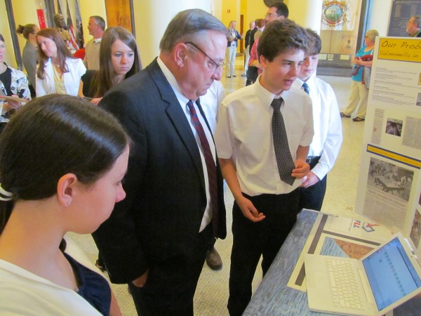 Dylan Roberts, a student at Mt. Blue Middle School in Farmington, explains to Gov. Paul LePage a robotics project he and others worked on that makes it easier to test for salmonella in eggs. Dylan Roberts, a student at Mt. Blue Middle School in Farmington, explains to Gov. Paul LePage a robotics project he and others worked on that makes it easier to test for salmonella in eggs.