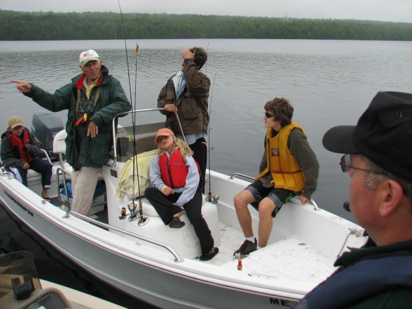 Stuart Langton of Sanibel, Fla., (in white hat) and his family chat with Joseph McBrine and Wayde Carter (off camera) of the Maine Warden Service on Saturday, June 23, 2012, on Hadley Lake in East Machias. Carter and McBrine were conducting boat safety checks as part of the service's Operation Dry Water program. Stuart Langton of Sanibel, Fla., (in white hat) and his family chat with Joseph McBrine and Wayde Carter (off camera) of the Maine Warden Service on Saturday, June 23, 2012, on Hadley Lake in East Machias. Carter and McBrine were conducting boat safety checks as part of the service's Operation Dry Water program.