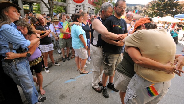 Same-sex couples embrace during a commitment ceremony at West Market Square in Bangor during the second annual Pride Festival Saturday. Any gay or straight couple was invited to participate in the ceremony. Same-sex couples embrace during a commitment ceremony at West Market Square in Bangor during the second annual Pride Festival Saturday. Any gay or straight couple was invited to participate in the ceremony.