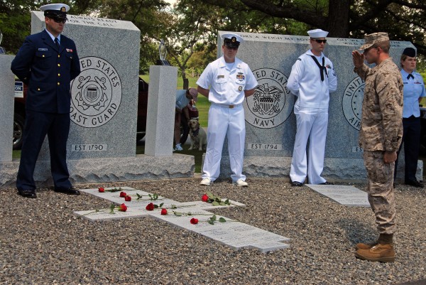 A serviceman places a rose on the veterans memorial at the Milo town cemetery during a dedication ceremony on Saturday, July 1, 2012. A serviceman places a rose on the veterans memorial at the Milo town cemetery during a dedication ceremony on Saturday, July 1, 2012.