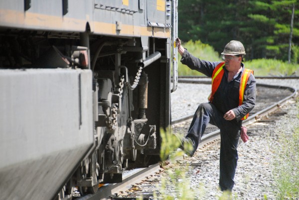 Montreal, Maine & Atlantic Railways worker David Black helped repair and test several locomotives in the company rail yard in Derby Maine on Saturday, July 21, 2012. Montreal, Maine & Atlantic Railways worker David Black helped repair and test several locomotives in the company rail yard in Derby Maine on Saturday, July 21, 2012.