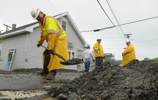 A Maine DOT worker shoves up loose gravel along Main Street in Brownville on Tuesday, June 26, 2012. Severe flooding in the region prompted Maine Gov. Paul LePage to vist the area to see the devastation for himself. A Maine DOT worker shoves up loose gravel along Main Street in Brownville on Tuesday, June 26, 2012. Severe flooding in the region prompted Maine Gov. Paul LePage to vist the area to see the devastation for himself.