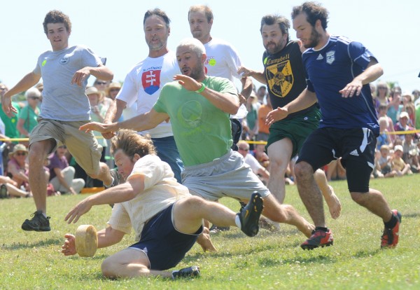 Dan Greeley, 45 of Belfast was the first to grab the wheel of cheese during an adult race in the sixth annual National Cheese Roll Championship Sunday, July 22, 2012. The event was among the many highlights of the three-day 2012 Maine Celtic Celebration in Belfast. The annual celebration features food, music and athletic competitions — all of which pay tribute to Maine's Celtic heritage. Dan Greeley, 45 of Belfast was the first to grab the wheel of cheese during an adult race in the sixth annual National Cheese Roll Championship Sunday, July 22, 2012. The event was among the many highlights of the three-day 2012 Maine Celtic Celebration in Belfast. The annual celebration features food, music and athletic competitions — all of which pay tribute to Maine's Celtic heritage.