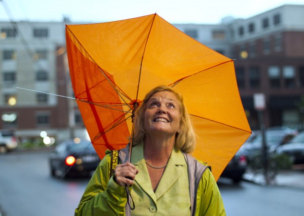U.S. Rep. Chellie Pingree, D-Maine, looks up to the skies during a thunderstorm that damaged her umbrella and forced the postponement of the Fourth of July fireworks show in Portland. U.S. Rep. Chellie Pingree, D-Maine, looks up to the skies during a thunderstorm that damaged her umbrella and forced the postponement of the Fourth of July fireworks show in Portland.
