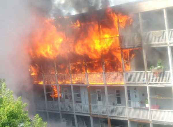 Flames quickly engulf the rear porches of 32-34 River Street in Lewiston Tuesday morning. Flames quickly engulf the rear porches of 32-34 River Street in Lewiston Tuesday morning.