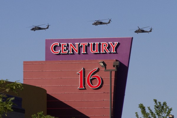 Three helicopters make a flyover of the Century Theater on Saturday, July 21, 2012 in Aurora, Colo. Twelve people were killed and dozens were injured in the attack early Friday at the packed theater during a showing of the Batman movie, "Dark Knight Rises." Police have identified the suspected shooter as James Holmes, 24. Three helicopters make a flyover of the Century Theater on Saturday, July 21, 2012 in Aurora, Colo. Twelve people were killed and dozens were injured in the attack early Friday at the packed theater during a showing of the Batman movie, "Dark Knight Rises." Police have identified the suspected shooter as James Holmes, 24.